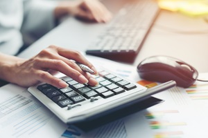 woman using calculator