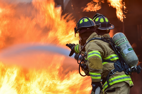 fire fighters putting out a house fire