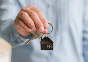 person holding house key