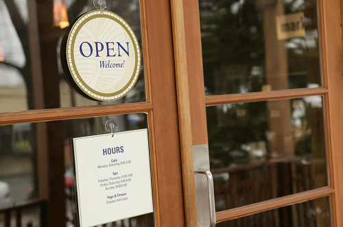 an open sign on a storefront window